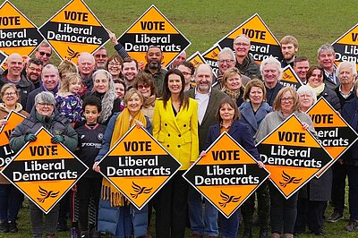 A photo of Monica with loads of Lib Dems